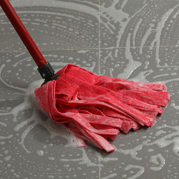 Cleaning the floor tiles with mop | Floor Systems